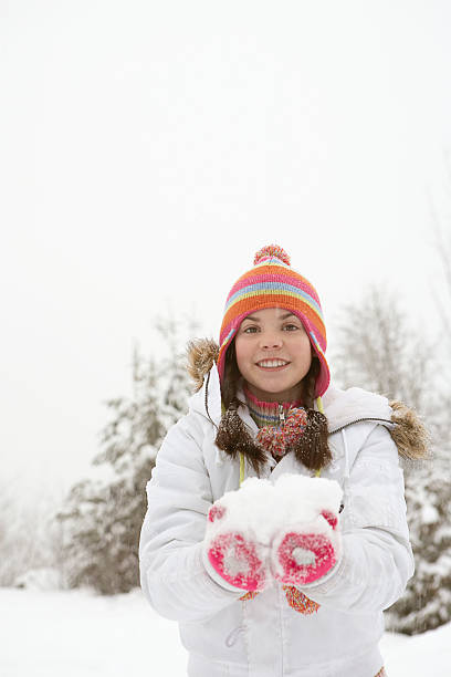 istock Girl holding snow ball 519163310