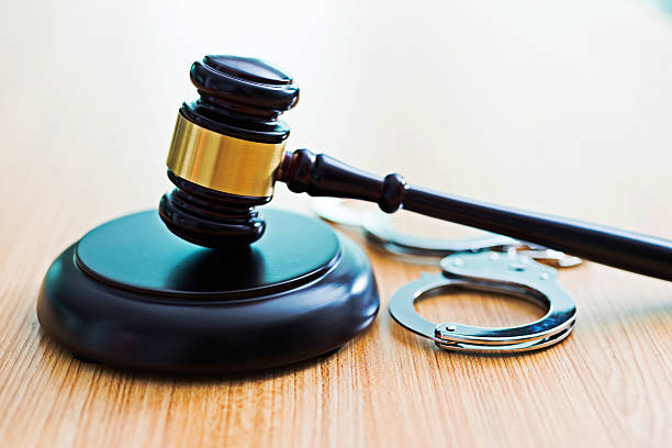 istock Gavel and handcuffs on desk 519163856