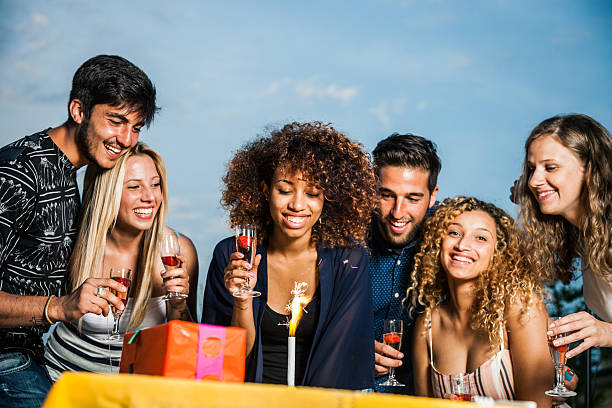 istock Friends celebrating a birthday party on a rooftop 519164952