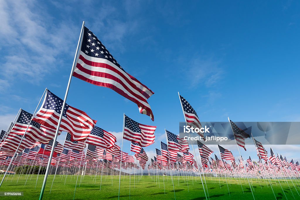 Field of American Flags A field of hundreds of American flags.  Commemorating veteran's day, memorial day or 9/11. US Memorial Day Stock Photo