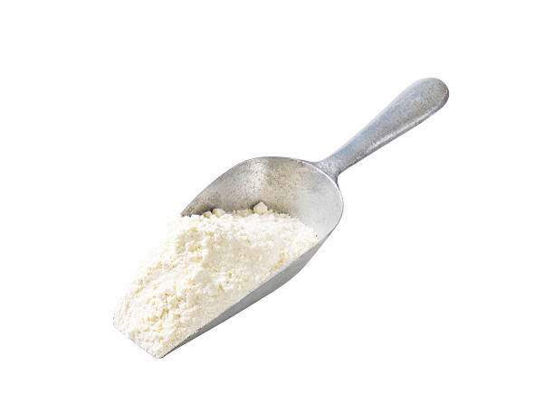 istock Scoop of wheat flour 519165880