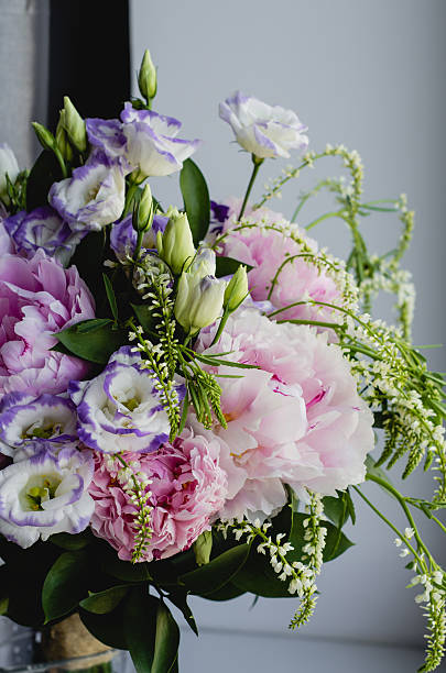 istock Rich bunch of pink peonies, eustoma, roses flowers. Rustic style. 519167302