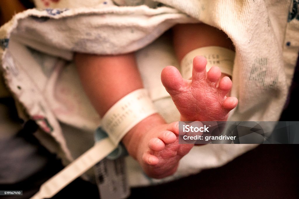 Cute Newborn Baby Feet Candid image of a newborn baby's feet just after birth in the hospital 0-11 Months Stock Photo