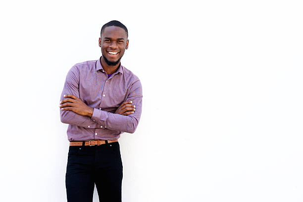 istock Happy young african guy with his arms crossed 519167518