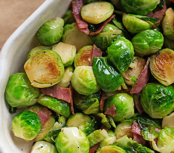 istock Close up shot of Brussels sprouts with ham. 519167544