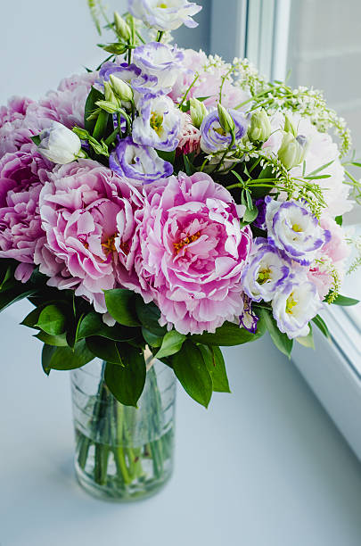 istock Rich bunch peony, eustoma, roses flowers in vase still life. 519167834