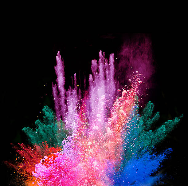 istock Explosion of colored powder on black background 519169262