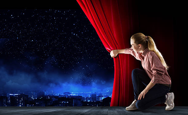 istock Girl opening curtain 519171239