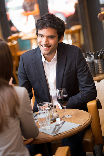 istock Cheerful couple drinking red wine in French restaurant 519171621
