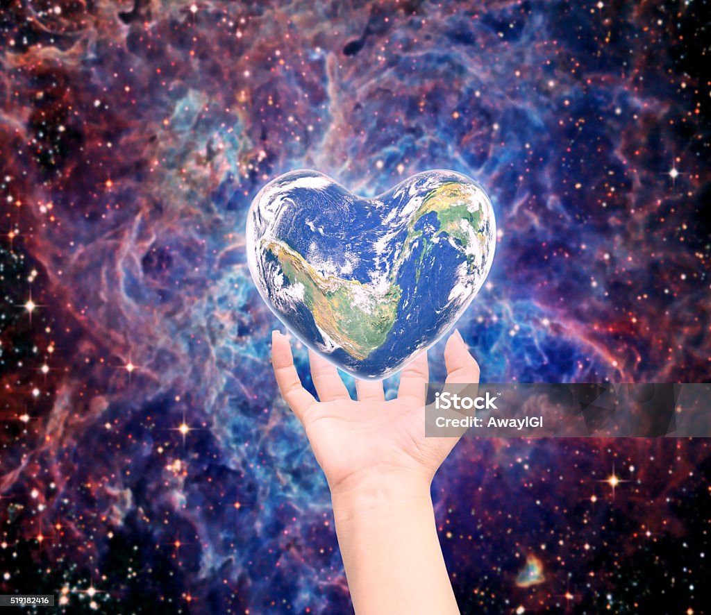 World in heart shape with over women human hands World in heart shape with over women human hands on blurred natural background blue cyan turquoise tree and sky: World Heart health day, CSR concept: Element of this image furnished by NASA Adult Stock Photo