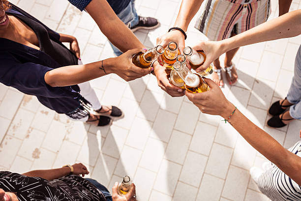 istock Friends having fun and drinking some beers outdoor 519184884