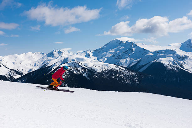 istock Female athlete skiing in the mountains 519185362