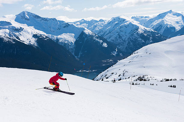 istock Female athlete skiing in the mountains 519185606