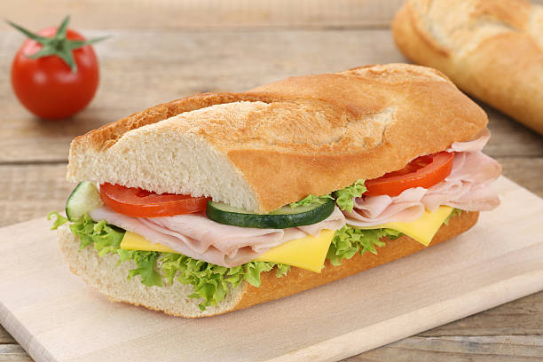 istock Sub sandwich baguette with ham for breakfast 519186012