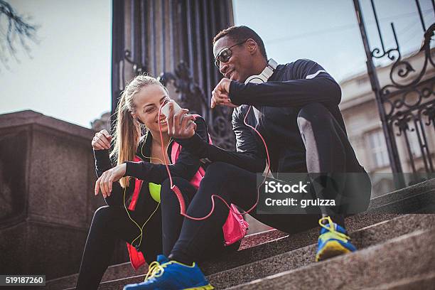 Young Fit Couple Relaxing After The Strenuous Workout Stock Photo - Download Image Now