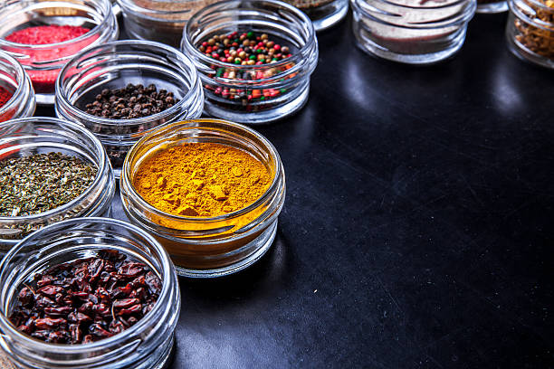 istock Spices on black background in jars. Food 519188272