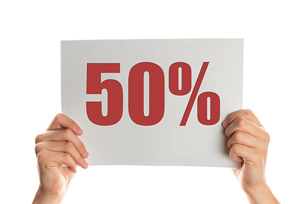istock Hand holding a banner with the words 50 percent 519188346