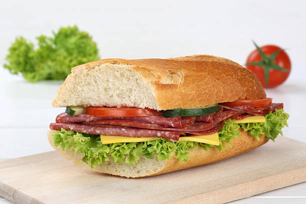 istock Sub sandwich baguette with salami ham 519188690