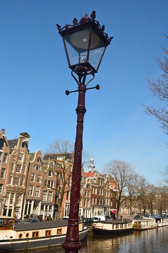 Old street lamp along Prinsengracht canal in Amsterdam. 