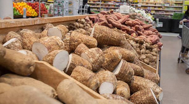 Varieties of yams on display at an oriental grocery store stock photo