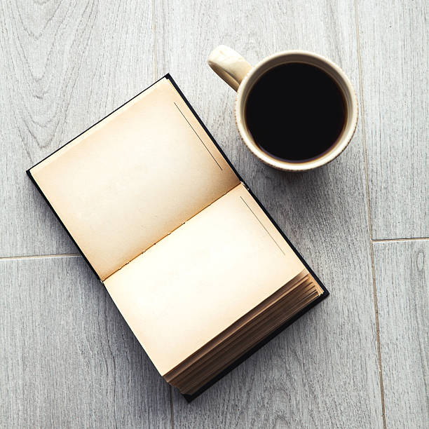 istock Large cup of coffee and open book. Education, hobby, drink. 519191954