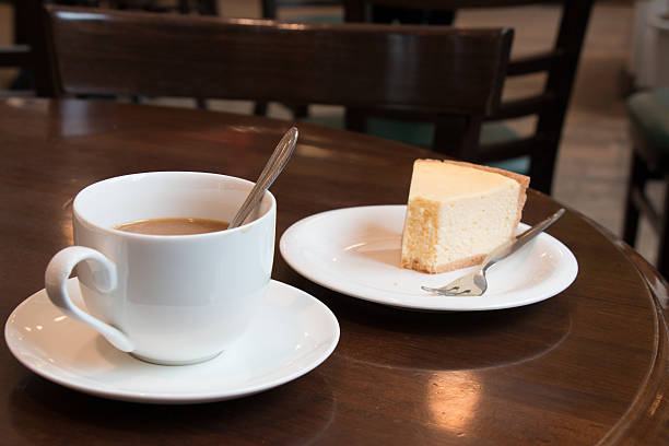 istock Coffee cup and Cheesecake in coffee shop 519194582