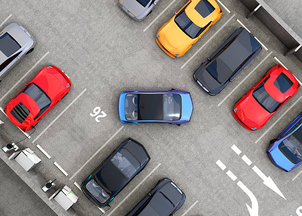 Aerial view of parking lot Aerial view of parking lot. Half of parking lot available for EV charging service. 3D rendering image. parking lot stock pictures, royalty-free photos & images
