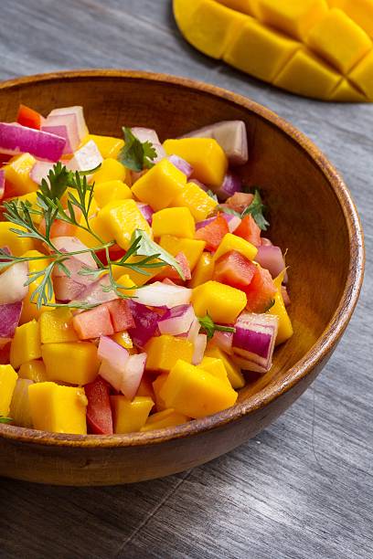 istock Homemade Mango salsa served in a wooden plate 519196330