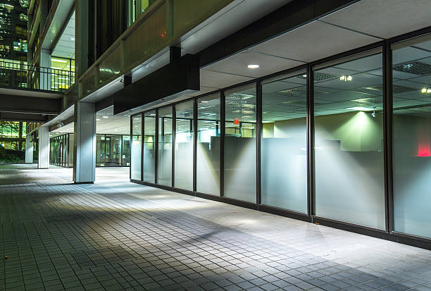 istock empty footpath front of modern business building at night 519196480