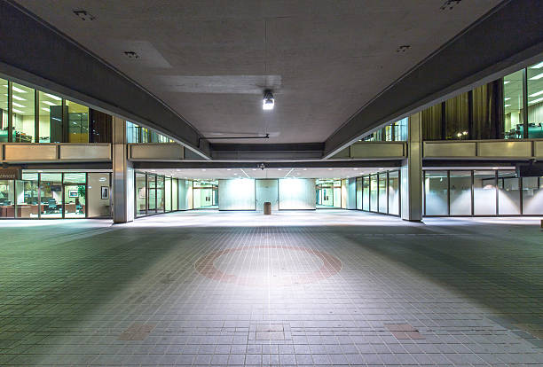 empty footpath front of modern business building at night