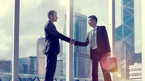 Asian Business Handshake Agreement Partnetship Concept