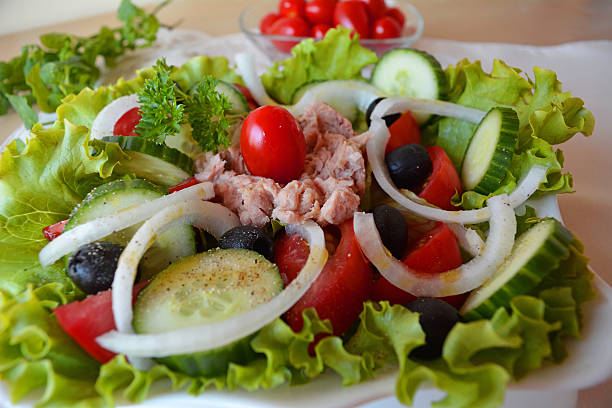 istock Mixed vegetable salad with tuna and olive oil 519217297