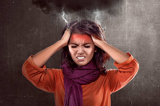 istock Asian woman wearing scarf looking sick 519218420
