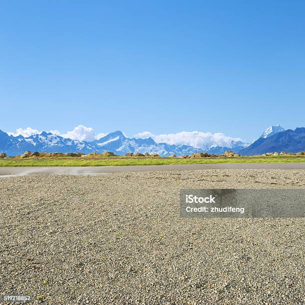 Empty Rural Road Near Snow Mountains In New Zealand Stock Photo - Download Image Now