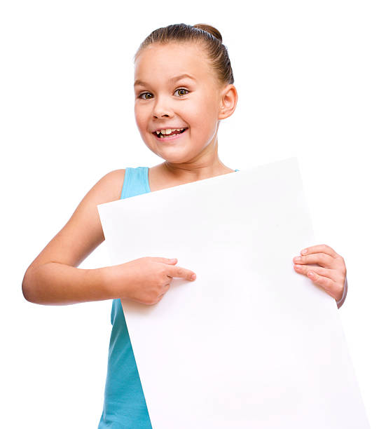 istock Little girl is holding blank banner 519219391