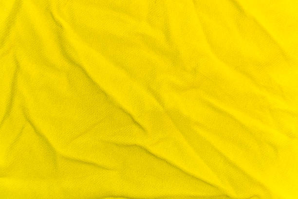 istock wrinkled bright yellow knitted fabric for the background 519219614