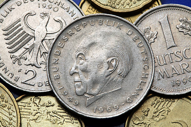 Coins of Germany Coins of Germany. German statesman Konrad Adenauer and the German eagle depicted in old Deutsche Mark coins. aquila heliaca stock pictures, royalty-free photos & images