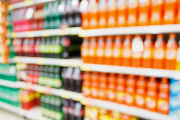 istock soft drink bottles on shelves in supermarket blur background 519219728