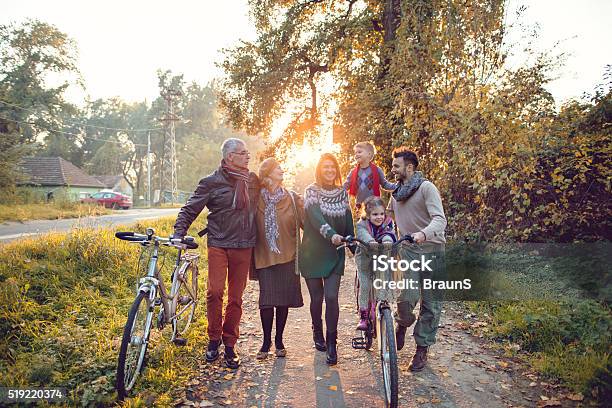 Happy Multigeneration Family Having Fun With Bikes In Autumn Da Stock Photo - Download Image Now