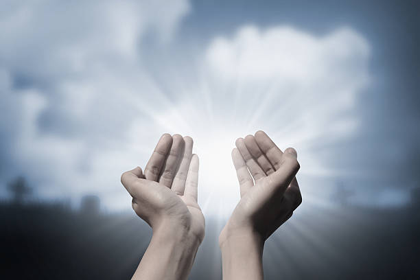 istock Human hand praying to god 519220454