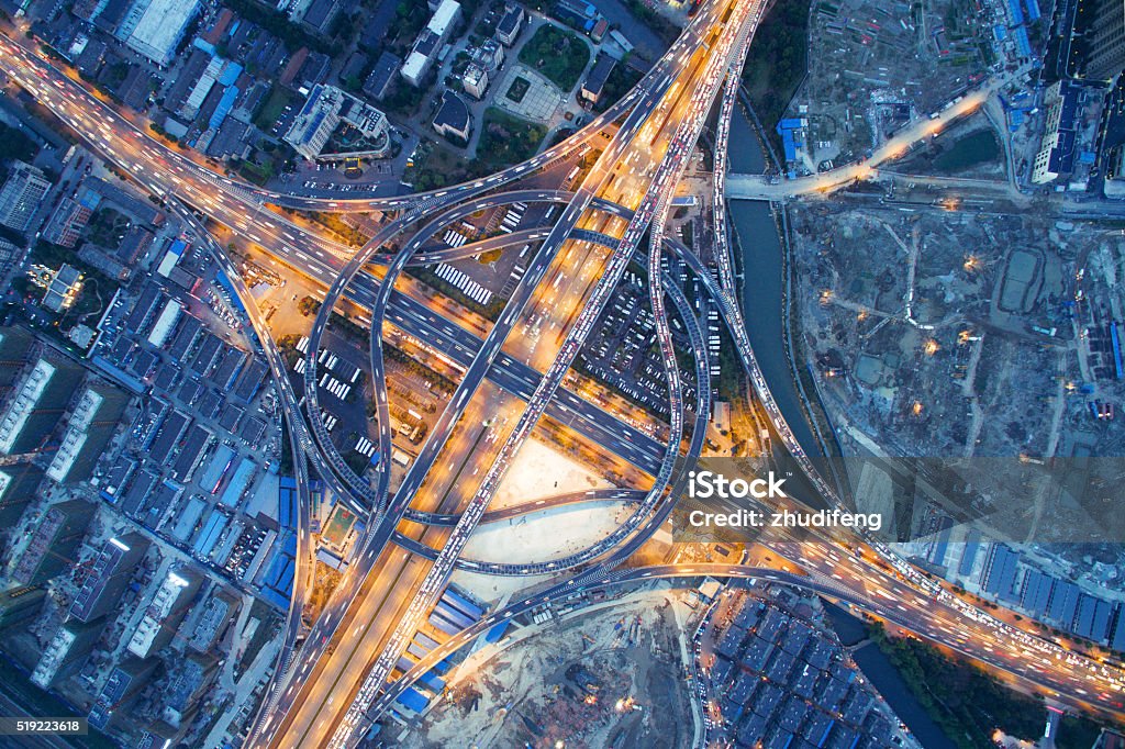 busy traffic on road junction at night in hangzhou aerial view of traffic on road junction at night in hangzhou Aerial View Stock Photo