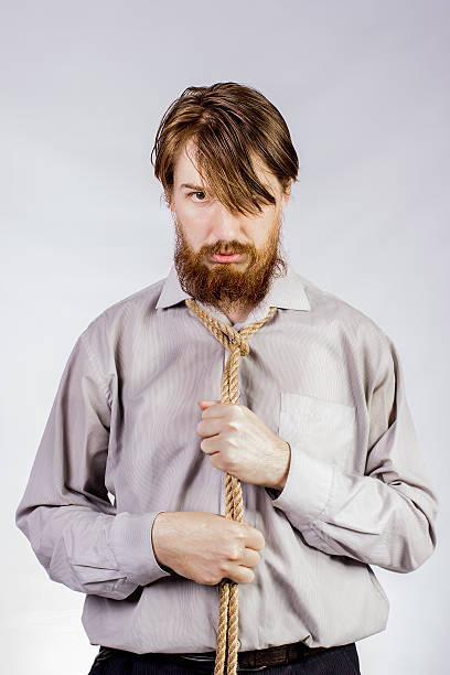 istock Bearded  man with a rope around his neck 519224498