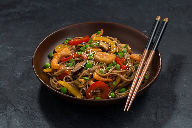 istock Buckwheat noodles with seafood in a bowl 519226104