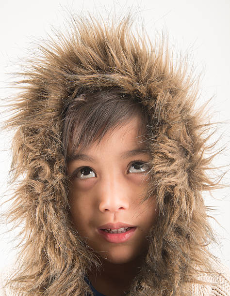 istock Little boy wearing fur coat protect from cold 519227382