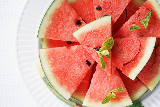 istock Watermelon. Slices of fresh watermelon on white 519228300