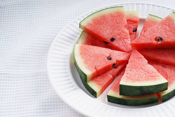 istock Watermelon. Slices of fresh watermelon on white 519228488
