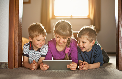 Kids using digital tablet.