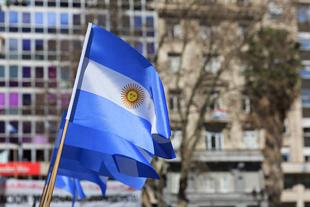 istock Argentina Flags with Cityscape 519248091