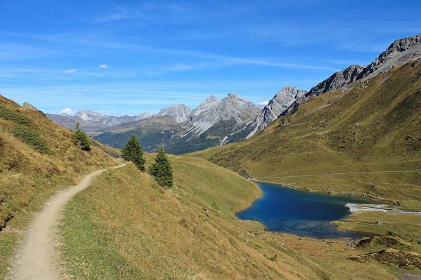 Lake Schwellisee and foot-path to Arosa Landscape in Arosa. arosa stock pictures, royalty-free photos & images