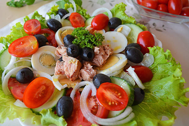 istock Mixed vegetable salad with tuna and olive oil 519253959